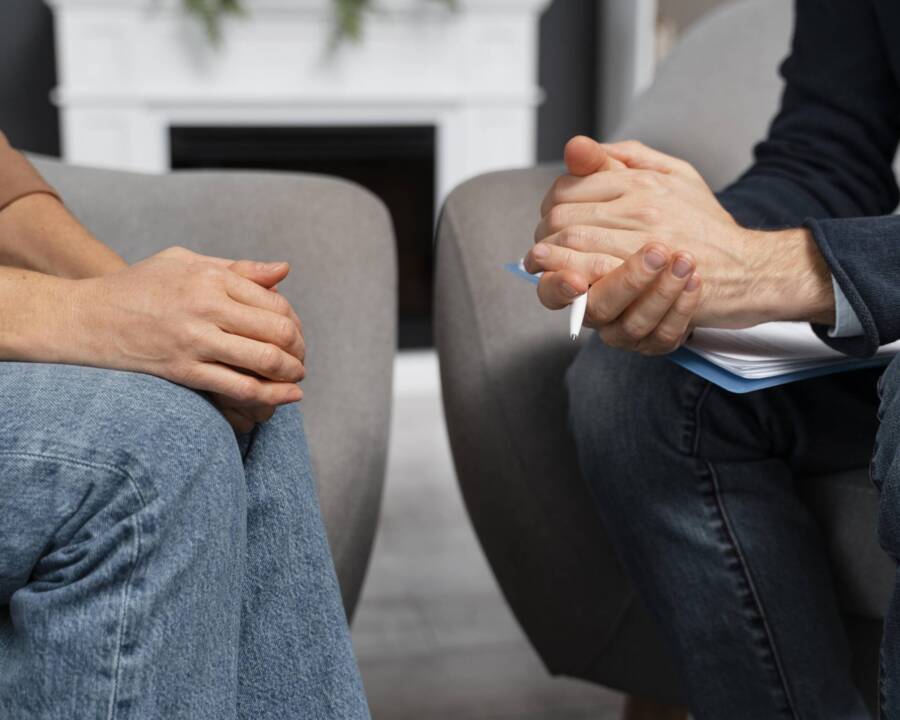 woman-counselor-holding-hands-together